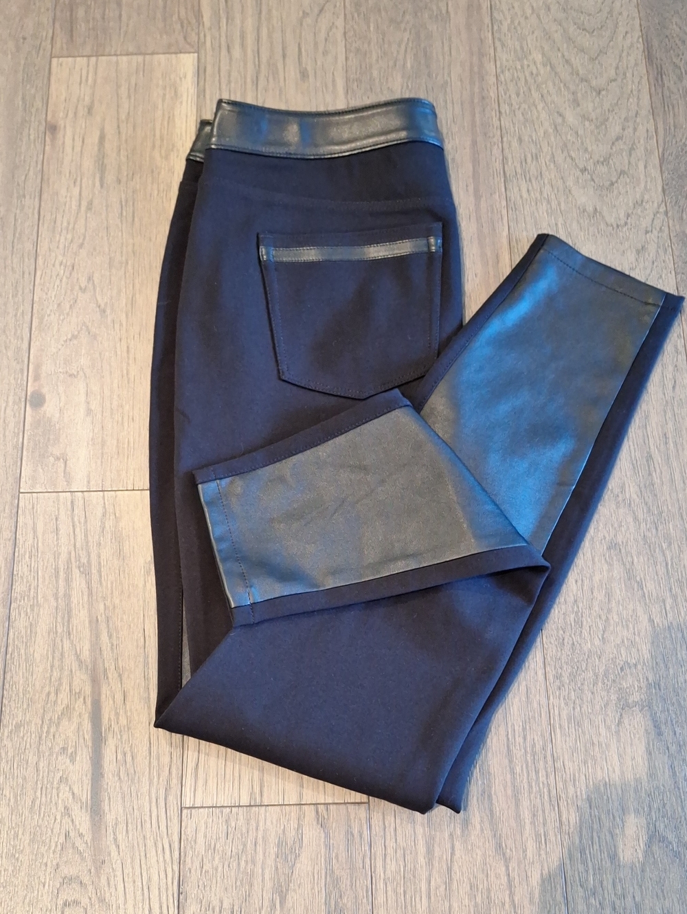 Vegan, leather, seamless style, tapered leg pants.[6]